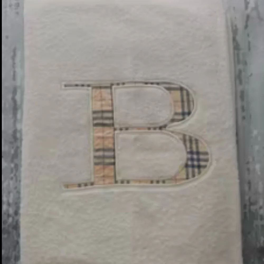 Burberry cream towel with Nova plaid 